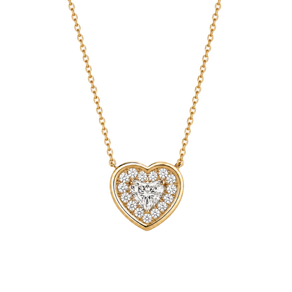 Heart-shaped diamond pendant on a gold chain against a white background