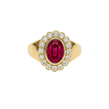 Gold ring with a ruby gemstone and diamond accents on a white background
